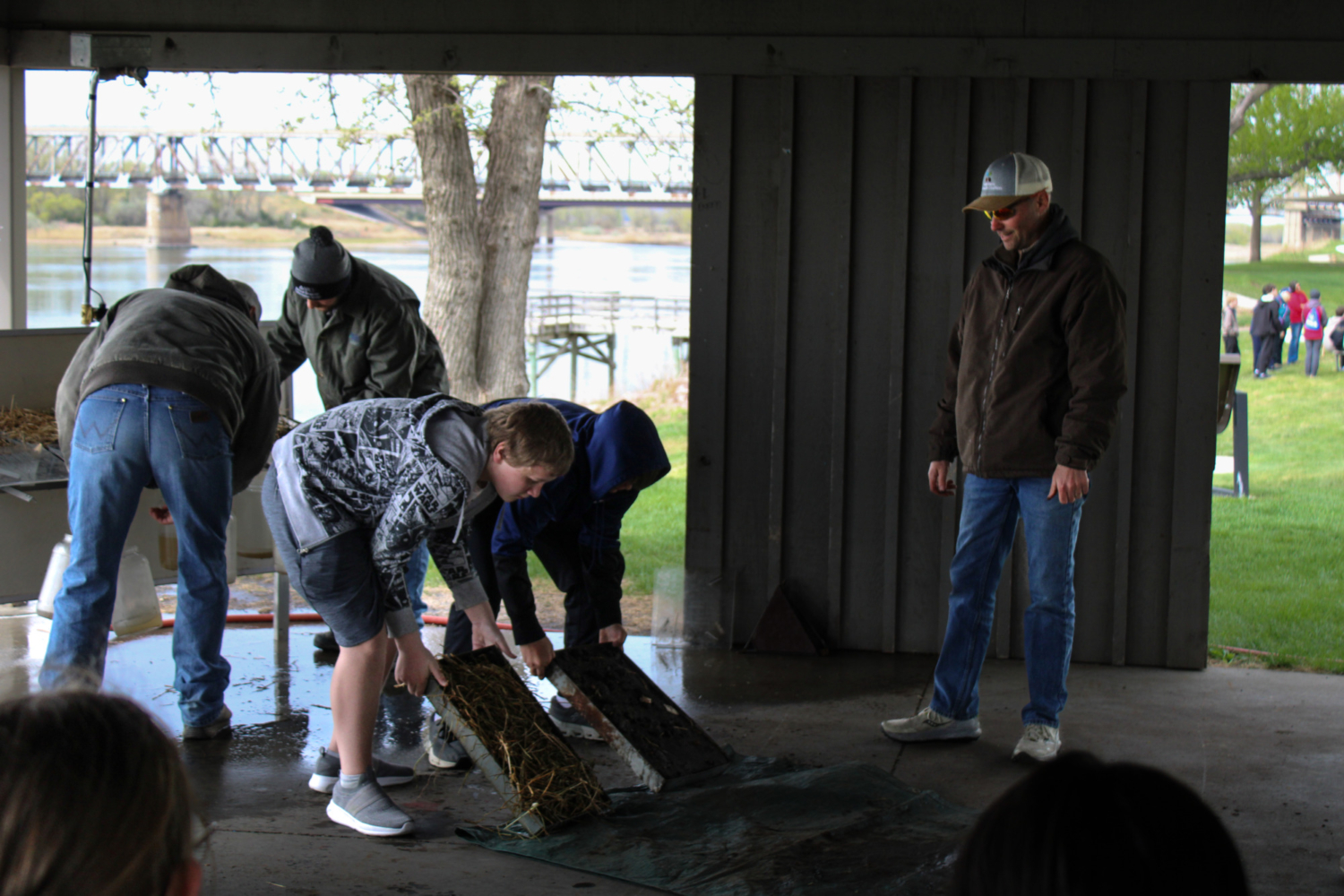 Students participate in a soil demonstration.